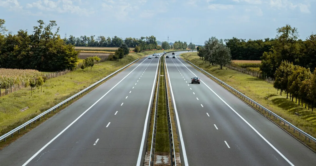 A car on a dual-carriageway motorway; since 1 October 2026 the vignette price depends on the Euro class